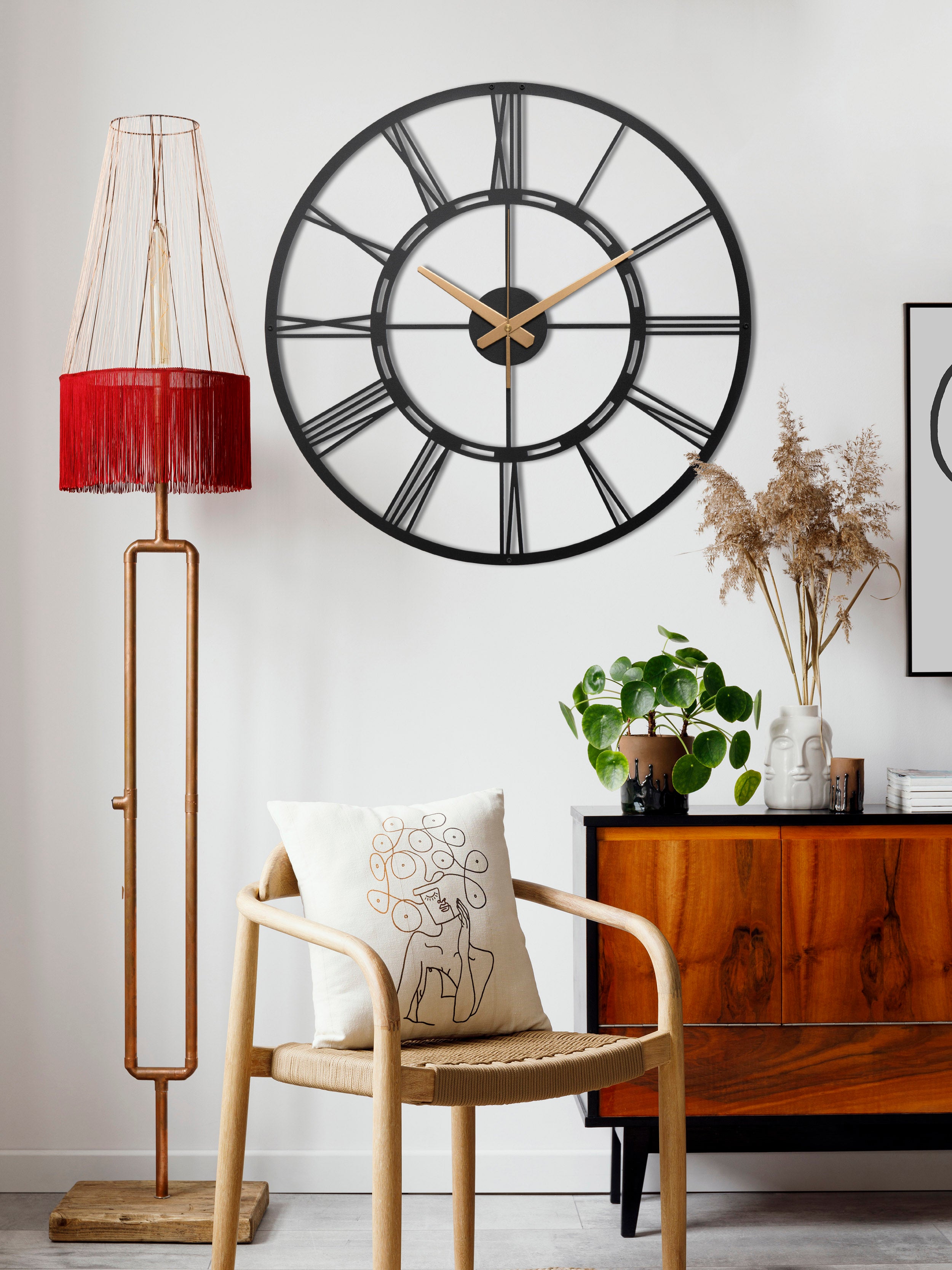 Unique Black Metal Wall Clock With White Roman Numbers