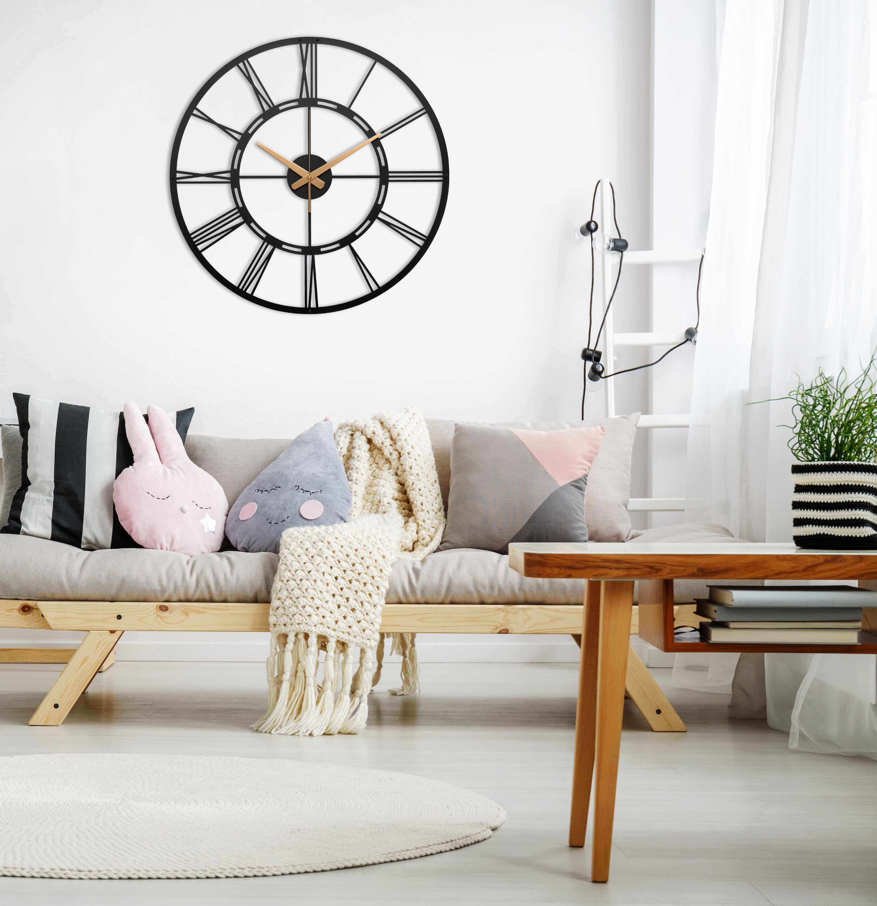 Unique Black Metal Wall Clock With White Roman Numbers